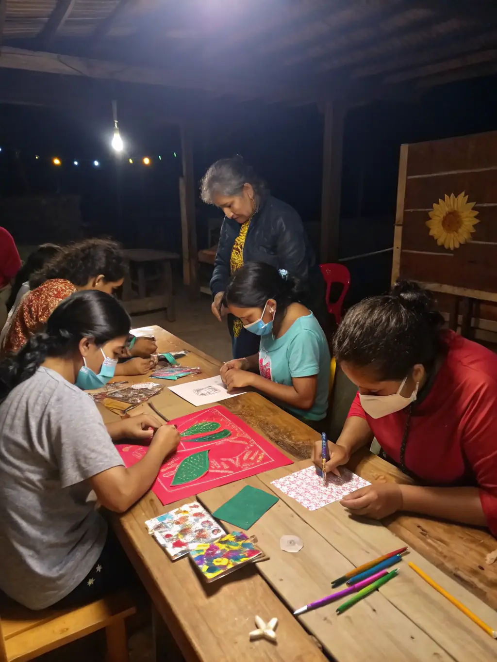 Participants in a traditional crafts workshop learning about local cultural heritage, guided by a skilled artisan, showcasing the region's artistic traditions.